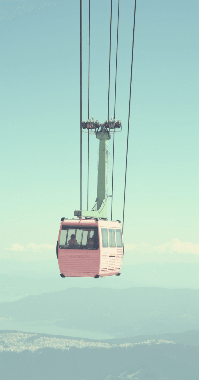 A cable car gliding high above mountains and water